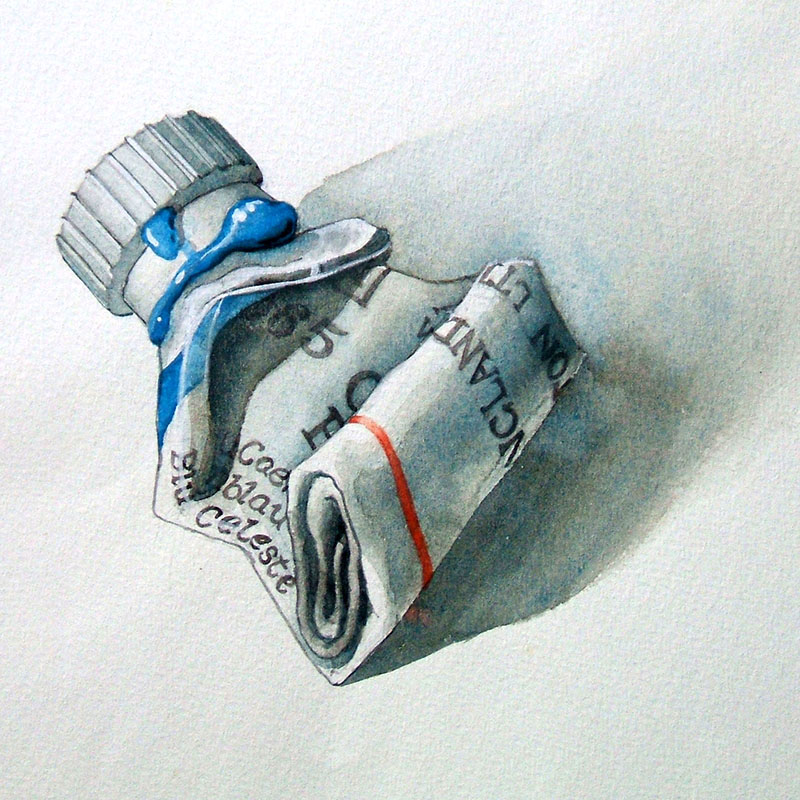 A squeezed, crumpled paint tube with blue paint leaking from the cap, lying on a light surface with a soft shadow. Some printed text and a red stripe are visible on the tube.