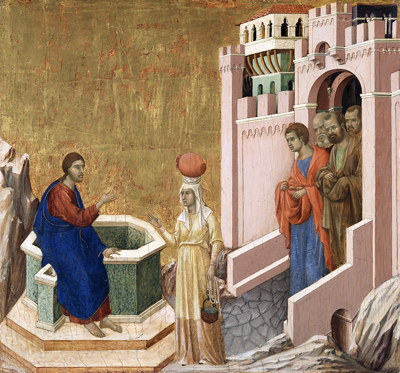 A medieval painting shows a man in blue robes sitting by a well, speaking to a woman with a red jug on her head. Three men stand nearby outside a pink stone building. The scene features gold leaf and stylized architecture.