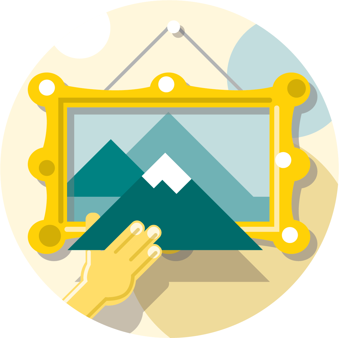 A yellow-framed picture of mountains hangs on a wall while a hand holds a paper cutout of mountains in front, aligning it with the image in the frame.